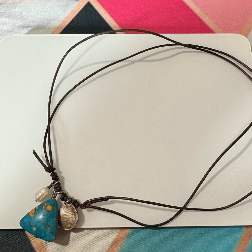 Necklace on leather rope with turquoise and mother of pearl